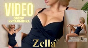 Видеообзор на слитный черный купальник с шикарным декольте и моделирующей драпировкой.