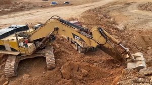 Caterpillar 365C Excavator Loading Mercedes & MAN Trucks
