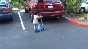 2 year old rides Yvolution Y Glider scooter