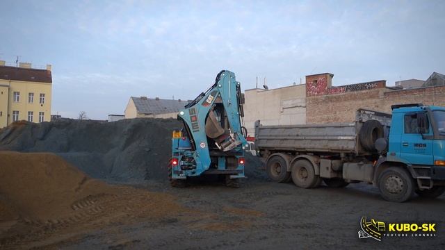 CAT 444F2 backhoe loading TATRA Terrno1 truck смотреть онлайн