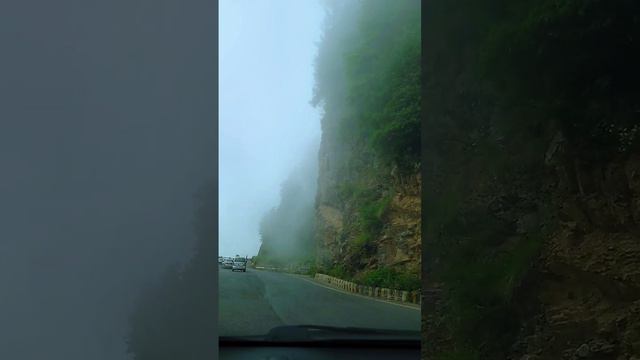 Enveloped in Mystique: Clouds Descending on Mountain Roads