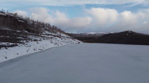 4K Frozen Mountain Lake Flyover