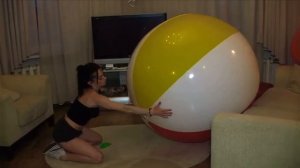 Girl playing with huge beachball