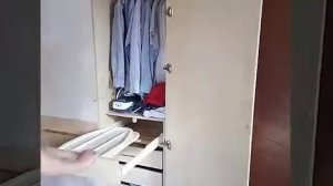 Шкаф в мансарде с выдвижными секциями и встроенной гладильной доской(стоимость 78.000)