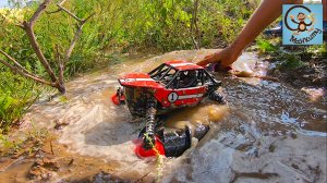 Красная Машинка игрушка ездит по воде, грязи и лужам. Манкиту