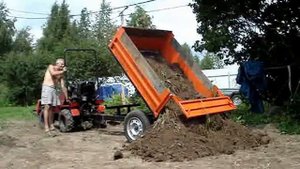 беларус132 с самосвальным прицепом уралец