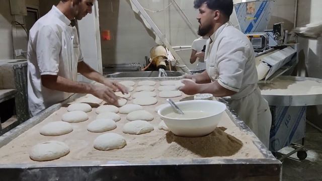 Baking Bread in BakeryBaking iranian Bread-Baking Barbari Bread in iran