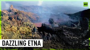 Mesmerizing Mount Etna lets red hot lava flow and collide with snow
