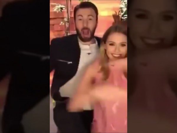 Chris Evans and Elizabeth Olsen dance