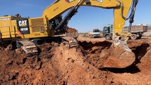 Caterpillar 6015B Excavator Loading Trucks - Sotiriadis Mining Works