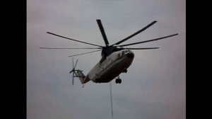 Ми 26 от "Росвертол Авиа" с подвеской забирает Ми-8 "Томск Авиа" и транспортирует в Колпашево