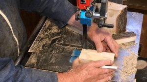 Richard Raffan cutting a split firewood log into woodturning blanks