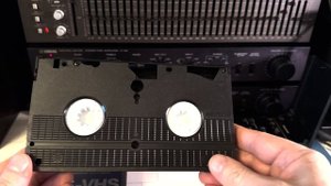 Распаковка новой S-VHS видеокассеты и подготовка к записи.