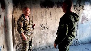 От удара ногой в живот после толчка в стену. В. Н. Крючков