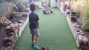 Playing Crazy Golf at Mighty Adventures Dinosaur Crazy Golf Course in Southampton UK Kids Fun Games