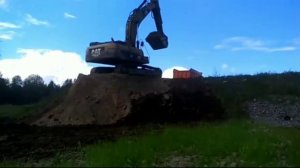 Грузим на КАМАЗе экскаватор САт прафесанал вадетил