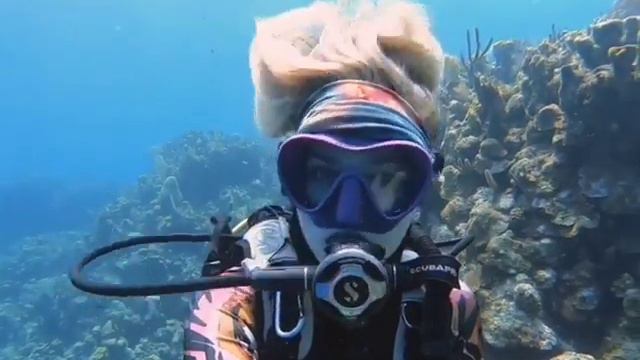 Female Scuba Diver Hair Moves Underwater