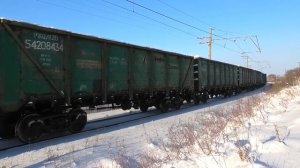 2ЭС6-401 "Синара" с грузовым поездом из снежных полувагонов