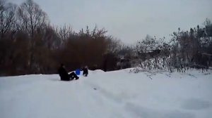 С горки на ледянках from the mountain on a sled in Russia