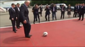 Belarus President Lukashenko plays soccer with Zabivaka at Moscow airport