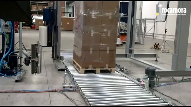 Автоматическая упаковка паллет. Паллетообмотчик Robopac с вращающейся рукой.