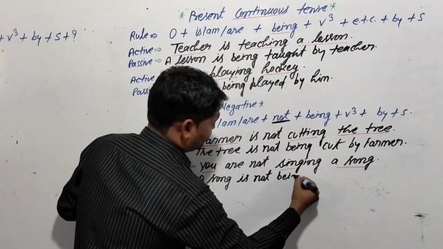 passive voice/ present continuous tense