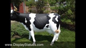 Life sized fiberglass cow statue