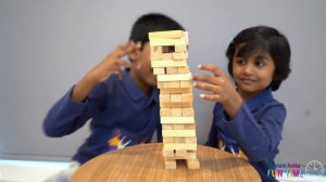 A tower made of wooden blocks by Jainam and Jivika(Wooden Tumbling Stacking Tower Game Toy)