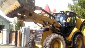 Погрузчик экскаватор CAT 434F | работа передней навески | демонстрация