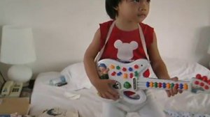 XAOLIN THE ROCKER w/toy guitar 3 yrs.