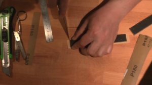 Процесс наклейки на двусторонний скотч шкурки на стеклянные бланки.