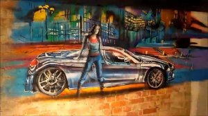 Спортивный автомобиль и город. Граффити роспись по кирпичной стене.