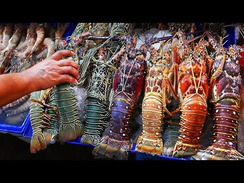 Тайская уличная еда - Гигантский радужный лобстер Хуа Хин морепродукты. Таиланд.