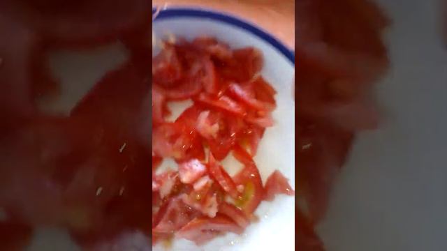 Tomatoes sliced for cooking sukuma for dinner