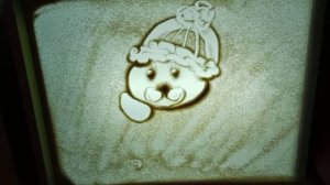 Рисование песком. Новогодняя иллюстрация