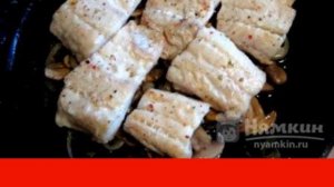 Slices of fish fillet with champignons baked in the oven