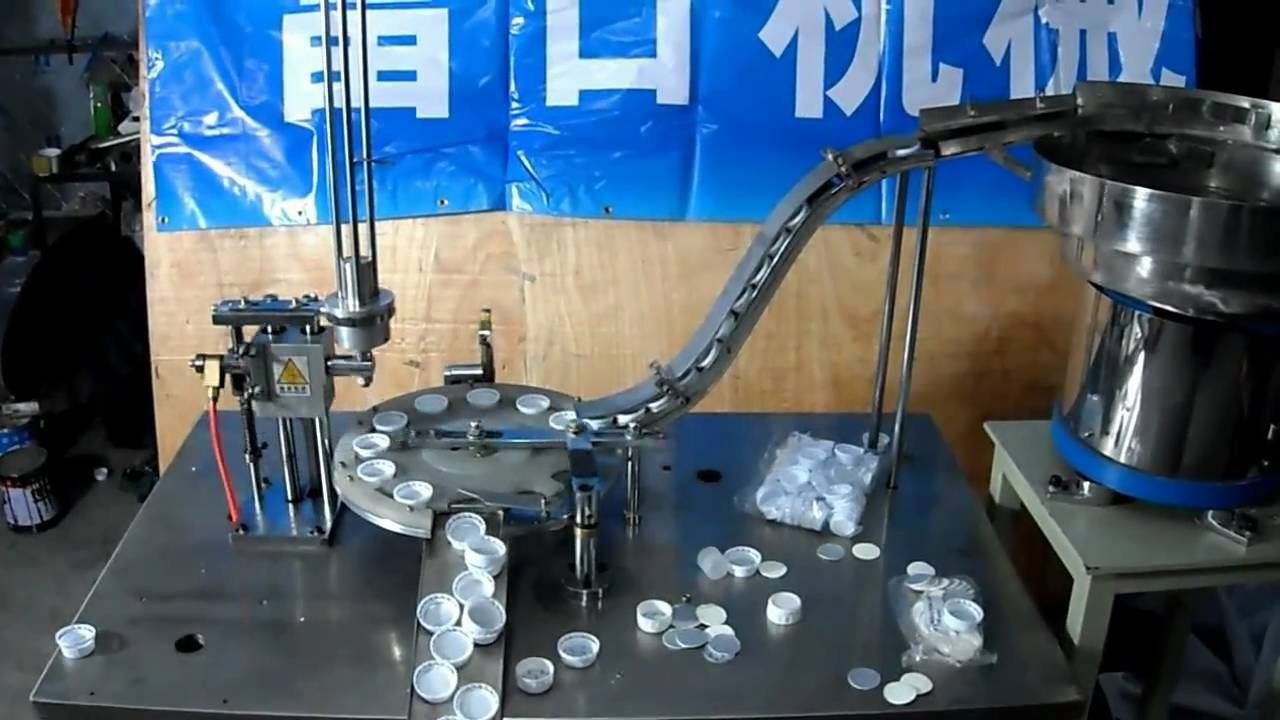 автомат для вкладывания вкладышей в крышку