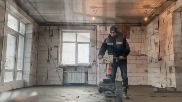 Шлифовка стяжки пола в Брянске вертолетом (Теплый водяной пол) раствор м200, 80 мм толщиной.