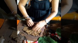 Local cigars being hand-rolled and sold in Philippines