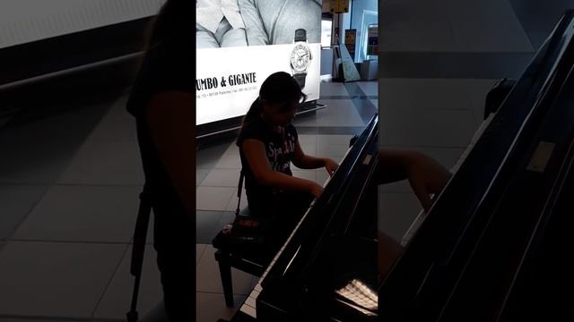 Playing the piano in Palermo airport