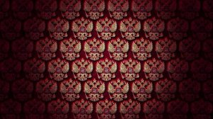 Золотые национальные гербы вкраплённые в красное полотно. Зацикленная анимация в 4K.