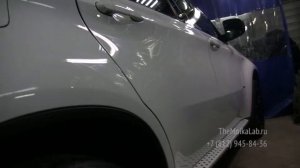 Защитное керамическое покрытие НКС 9H на белом автомобиле