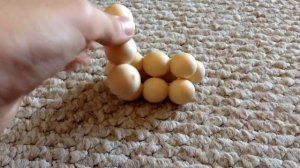 How to solve the wooden ball pyramid puzzle