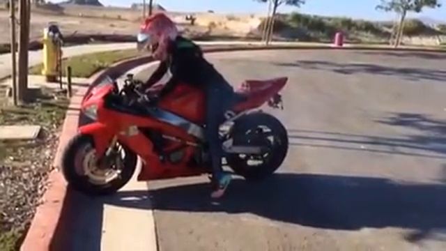 Hot biker girl Ms Envy does burnout on her Kawasaki Ninja 636