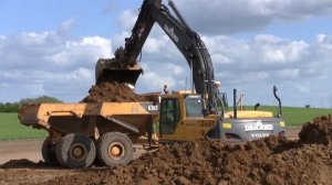 Volvo EC240B Loading Hydrema And Volvo ADT's