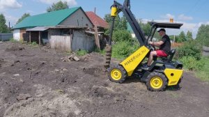 Бурим мини погрузчиком лунки под буронабивной фундамент