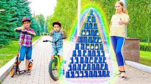 Erik and Gleb play with colored cups and cycling on bike.