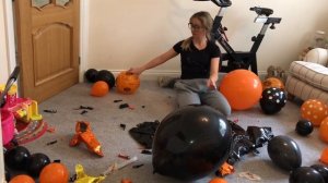 Clearing away Halloween balloon party balloons