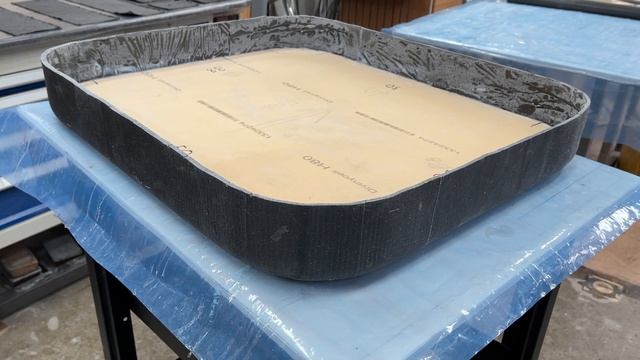 Laminating inside aft bulkhead hatch. This creates a sandwich construction a strong hatch.