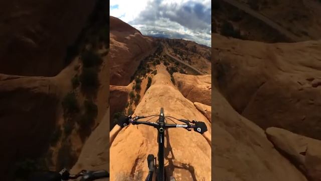 MTBer rides down a cliff with no climbing gear